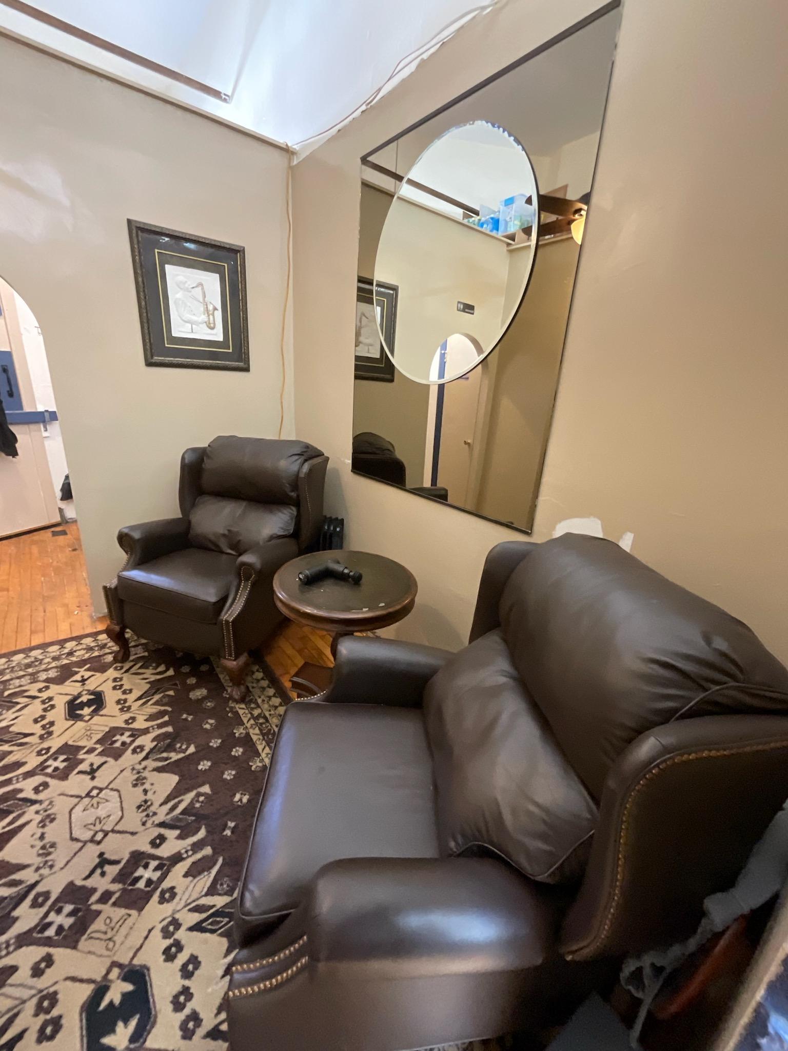 Comfortable lounge area inside the barbershop